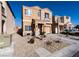 Two-story house with tan exterior and two-car garage at 6074 Lazarro Ct, Las Vegas, NV 89139