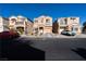 Three-story townhouses with attached garages and front yards at 6074 Lazarro Ct, Las Vegas, NV 89139