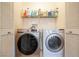 Laundry room with washer, dryer, and shelving at 6074 Lazarro Ct, Las Vegas, NV 89139