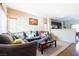 Living room with sectional sofa, coffee table, and hardwood floors at 6074 Lazarro Ct, Las Vegas, NV 89139