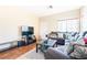 Living room with sectional sofa, coffee table, and hardwood floors at 6074 Lazarro Ct, Las Vegas, NV 89139