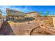 Landscaped backyard with gravel, plants, and a patio at 6228 Wood Stork Ave, Las Vegas, NV 89122