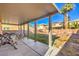 Covered patio, grassy area, and room for outdoor furniture at 6228 Wood Stork Ave, Las Vegas, NV 89122