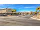 Gated community entrance with signage and ample parking at 6228 Wood Stork Ave, Las Vegas, NV 89122