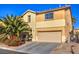 Two-story house with beige exterior, palm tree, attached garage, and driveway at 6228 Wood Stork Ave, Las Vegas, NV 89122