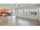 Kitchen with wood cabinets and island overlooking living room at 6228 Wood Stork Ave, Las Vegas, NV 89122