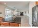 Kitchen with island and granite countertops overlooks the living room at 6228 Wood Stork Ave, Las Vegas, NV 89122