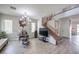 Living room with wood floors, staircase, and large TV at 6228 Wood Stork Ave, Las Vegas, NV 89122