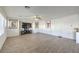 Spacious living room with wood-look floors and large windows at 6228 Wood Stork Ave, Las Vegas, NV 89122