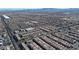 Large aerial view of houses, roads, and distant mountains at 6641 Hurkling Stone Ave, Las Vegas, NV 89139