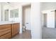 Guest bathroom with toilet and single vanity at 6641 Hurkling Stone Ave, Las Vegas, NV 89139