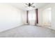 Main bedroom with sliding barn door and ceiling fan at 6641 Hurkling Stone Ave, Las Vegas, NV 89139