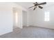 Spacious bedroom with ceiling fan and carpet at 6641 Hurkling Stone Ave, Las Vegas, NV 89139