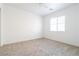 Well-lit bedroom with ceiling fan and carpet at 6641 Hurkling Stone Ave, Las Vegas, NV 89139