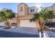 Two-story house with attached garage and palm trees at 6641 Hurkling Stone Ave, Las Vegas, NV 89139