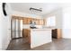 Kitchen with wood cabinets, stainless steel appliances, and an island at 6641 Hurkling Stone Ave, Las Vegas, NV 89139