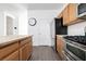 Kitchen features wood cabinets, stainless steel appliances, and an island at 6641 Hurkling Stone Ave, Las Vegas, NV 89139