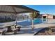 Community pool with covered seating area nearby at 6641 Hurkling Stone Ave, Las Vegas, NV 89139