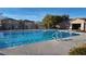 Community pool with pool house and surrounding houses at 6641 Hurkling Stone Ave, Las Vegas, NV 89139