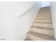 Carpeted staircase with simple white railing at 6641 Hurkling Stone Ave, Las Vegas, NV 89139