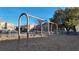 Playground swings with surrounding community houses at 6641 Hurkling Stone Ave, Las Vegas, NV 89139