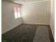 Spacious bedroom with new grey carpeting and window with awning at 730 S Royal Crest Cir # 445, Las Vegas, NV 89169