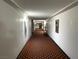 Clean condo hallway with patterned carpet at 730 S Royal Crest Cir # 445, Las Vegas, NV 89169