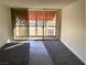 Living room with balcony access and new carpet at 730 S Royal Crest Cir # 445, Las Vegas, NV 89169