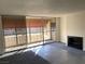 Living room with fireplace, balcony access and wet bar at 730 S Royal Crest Cir # 445, Las Vegas, NV 89169