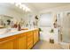 Bright bathroom with double vanity and shower at 7317 Wild Roar Ave, Las Vegas, NV 89129