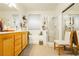 Bathroom features a soaking tub, shower, and wooden vanity at 7317 Wild Roar Ave, Las Vegas, NV 89129