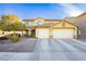 Two-story house with a landscaped yard and two-car garage at 7317 Wild Roar Ave, Las Vegas, NV 89129