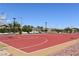 Outdoor basketball court with red surface and hoops at 7336 N Decatur Blvd # 2, Las Vegas, NV 89131