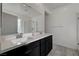 Modern bathroom with dual sinks and a large mirror at 7336 N Decatur Blvd # 2, Las Vegas, NV 89131