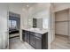 Bathroom with a double vanity and a view of the bedroom at 7336 N Decatur Blvd # 2, Las Vegas, NV 89131