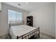 Simple bedroom with a metal bed frame and small bookcase at 7336 N Decatur Blvd # 2, Las Vegas, NV 89131