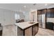 Open concept kitchen with island and stainless steel appliances at 7336 N Decatur Blvd # 2, Las Vegas, NV 89131