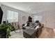 Living area with gray sectional, guitar stands and a coffee table at 7336 N Decatur Blvd # 2, Las Vegas, NV 89131