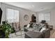 Living room with gray sectional sofa, a coffee table, and potted plant at 7336 N Decatur Blvd # 2, Las Vegas, NV 89131