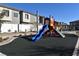 Modern playground with slides, climbing structures, and safety surface at 7336 N Decatur Blvd # 2, Las Vegas, NV 89131