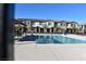 Community pool with lounge chairs and adjacent buildings at 7336 N Decatur Blvd # 2, Las Vegas, NV 89131