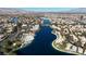 Wide aerial view of lake community and surrounding landscape at 7608 Sea Wind Dr, Las Vegas, NV 89128