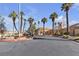 Community center with palm trees and circular driveway at 7608 Sea Wind Dr, Las Vegas, NV 89128