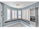 Kitchen window seat with white shutters and gray cushions at 7608 Sea Wind Dr, Las Vegas, NV 89128