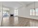 Spacious living room featuring hardwood floors and lots of natural light at 7608 Sea Wind Dr, Las Vegas, NV 89128