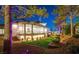 Backyard view featuring a covered patio and lush landscaping at 7880 Dana Point Ct, Las Vegas, NV 89117