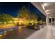 An inviting backyard featuring a pool, outdoor kitchen with grill, fire pit, and covered patio for entertaining at 7880 Dana Point Ct, Las Vegas, NV 89117
