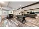 Large basement rec room with a pool table, wet bar, media area, and stylish flooring at 7880 Dana Point Ct, Las Vegas, NV 89117