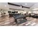 A spacious entertainment room in the basement with a pool table, theater seating and a full bar at 7880 Dana Point Ct, Las Vegas, NV 89117