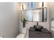 Modern powder room featuring designer sink, wall lighting and stylish decor at 7880 Dana Point Ct, Las Vegas, NV 89117